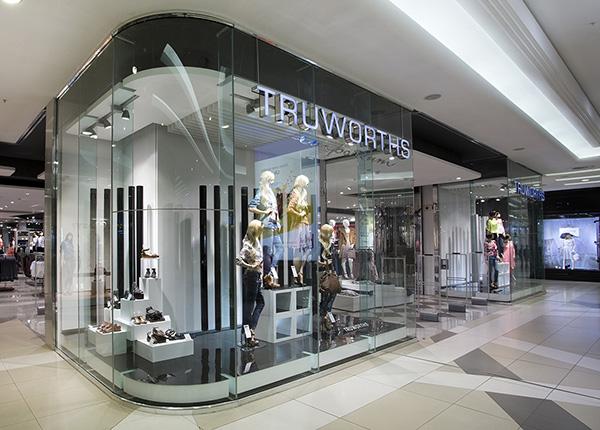 Truworths adopts Centric Software Product Lifecycle Management Featured A sleek, modern storefront with glass walls and the name "Truworths" displayed at the top. Mannequins dressed in trendy clothing are showcased inside the store, which is located in a spacious, well-lit shopping mall with a polished floor. Discover fashion enhanced by Centric Software PLM for ultimate style solutions.